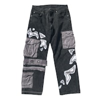 a pair of black cargo pants with white patches on them